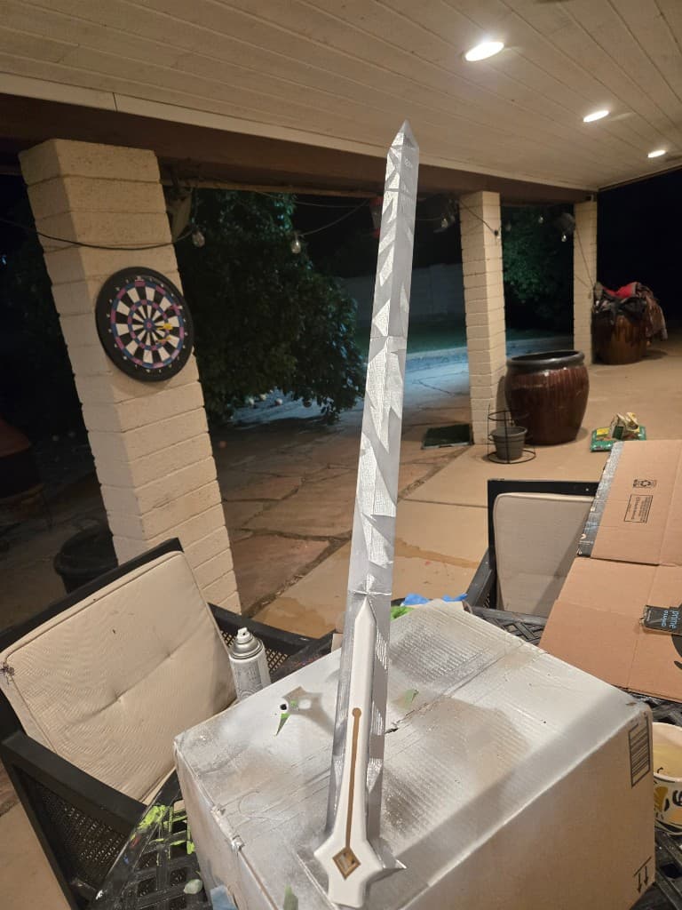 Recovered blade finish with deep geometric silver striations after the paint panic