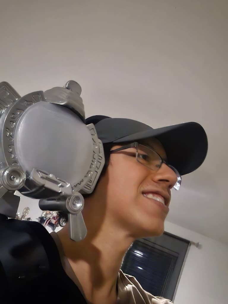 Low-angle portrait wearing the finished Max prop on the shoulder with support structure visible