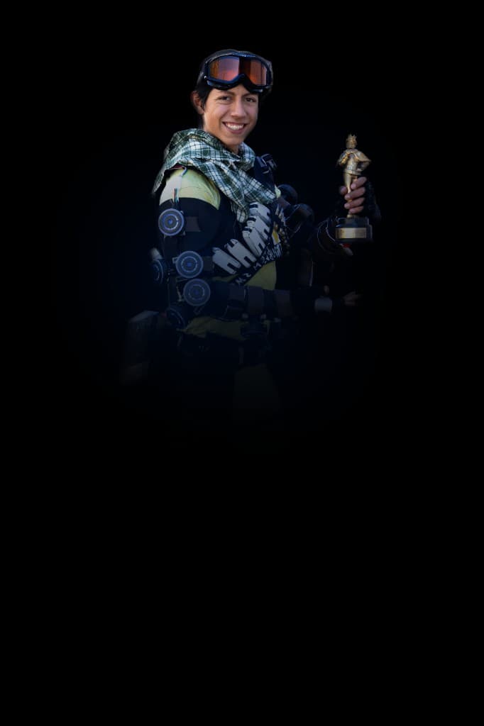 Gabriel holding an award in a custom electromechanical costume