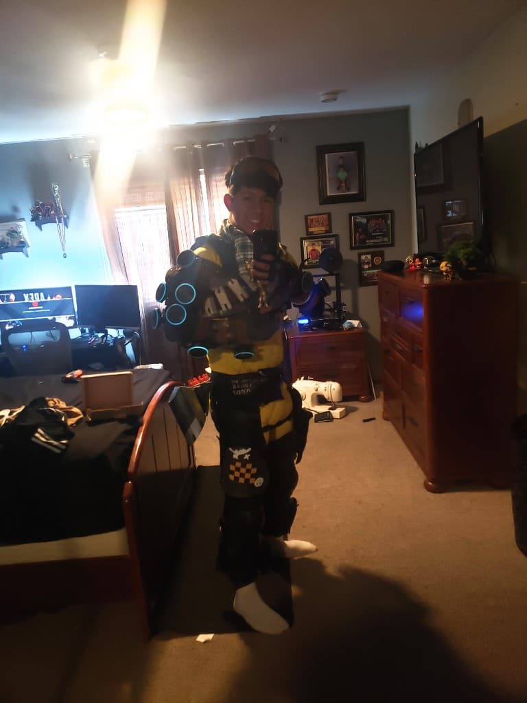 Early HoloDevice V2 cosplay worn with glowing arm-mounted holo emitters